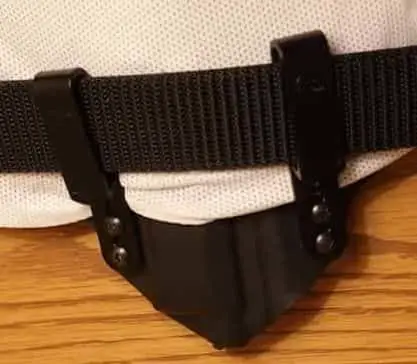 Showing shirt behind belt clips